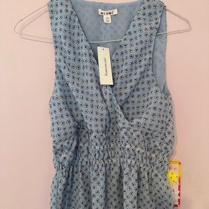 A light blue flower print top, Brand New with a Francesca tag, XXS size.